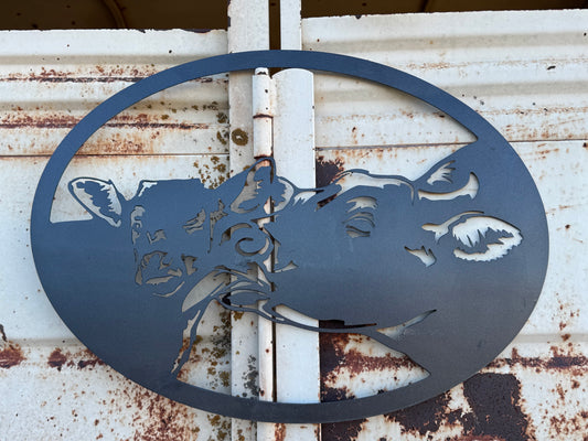 Metal mama and baby cow sign